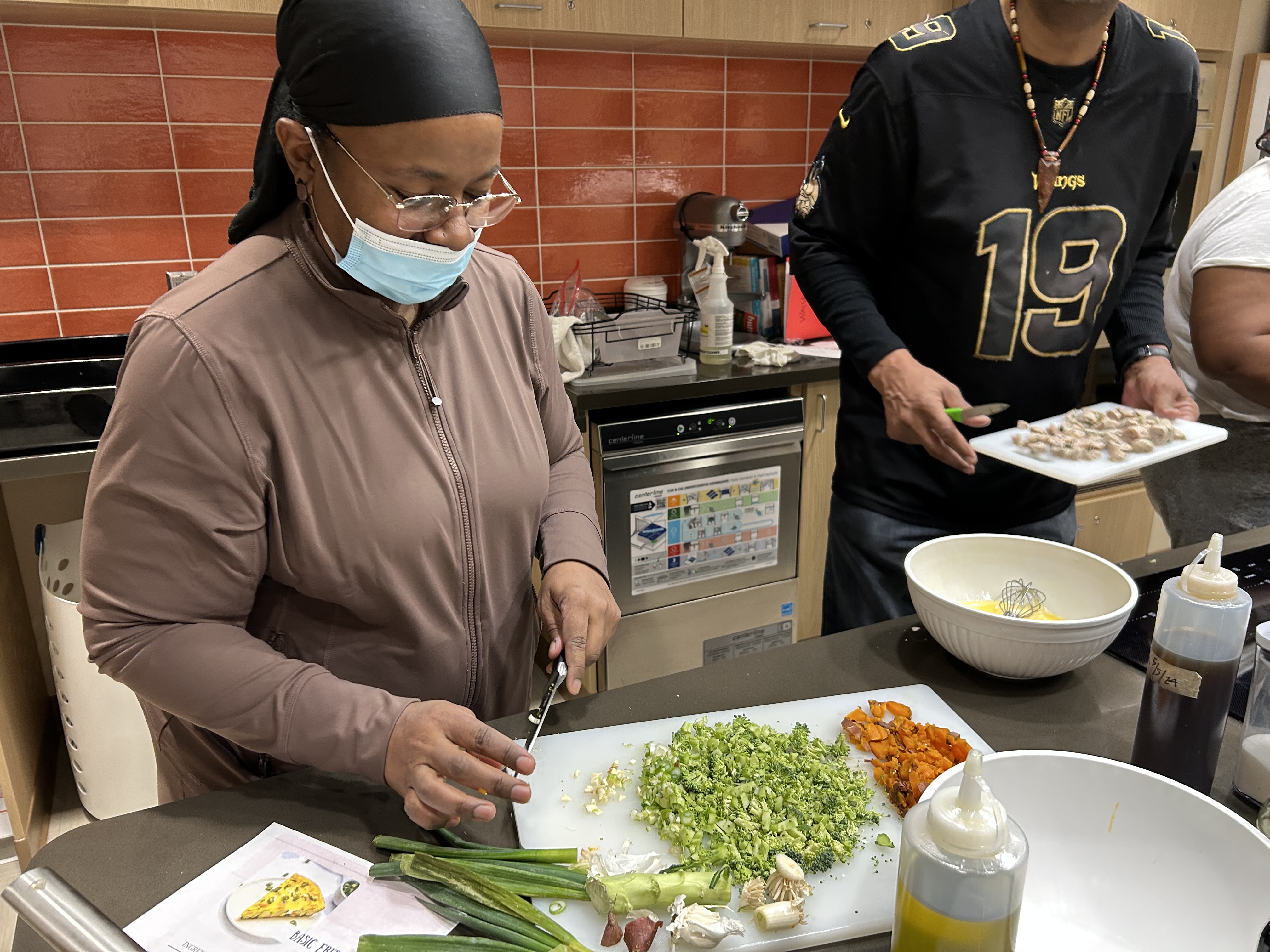 Person cooking using a cutting board