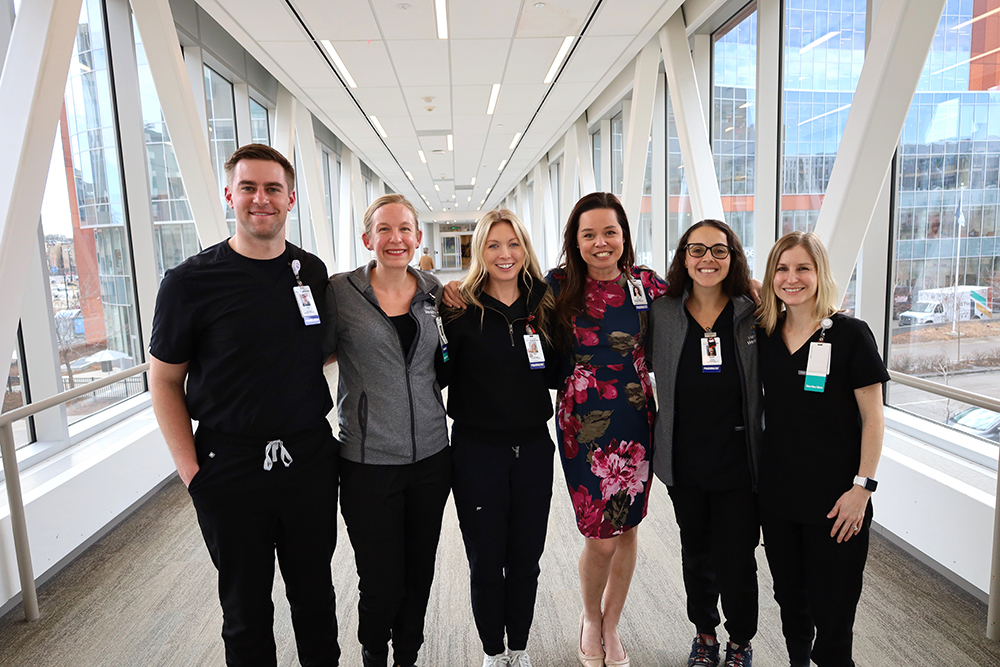 pharmacy team posting for a picture in the skyway